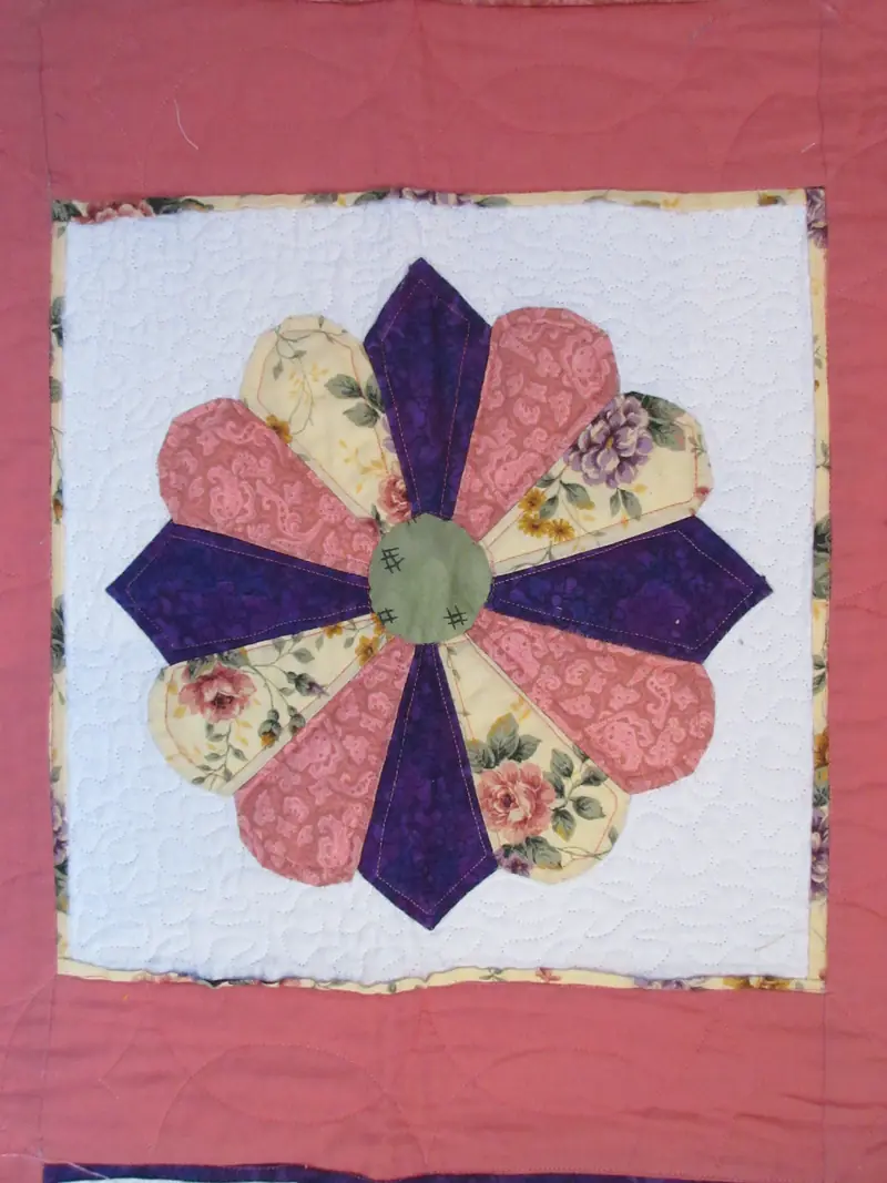 Dresden plate quilt block in pink and purple