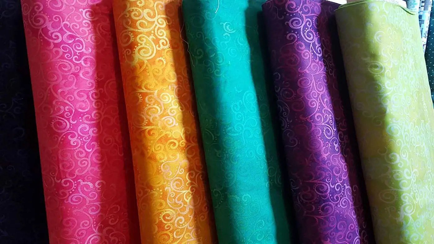 Rolls of bright fabric