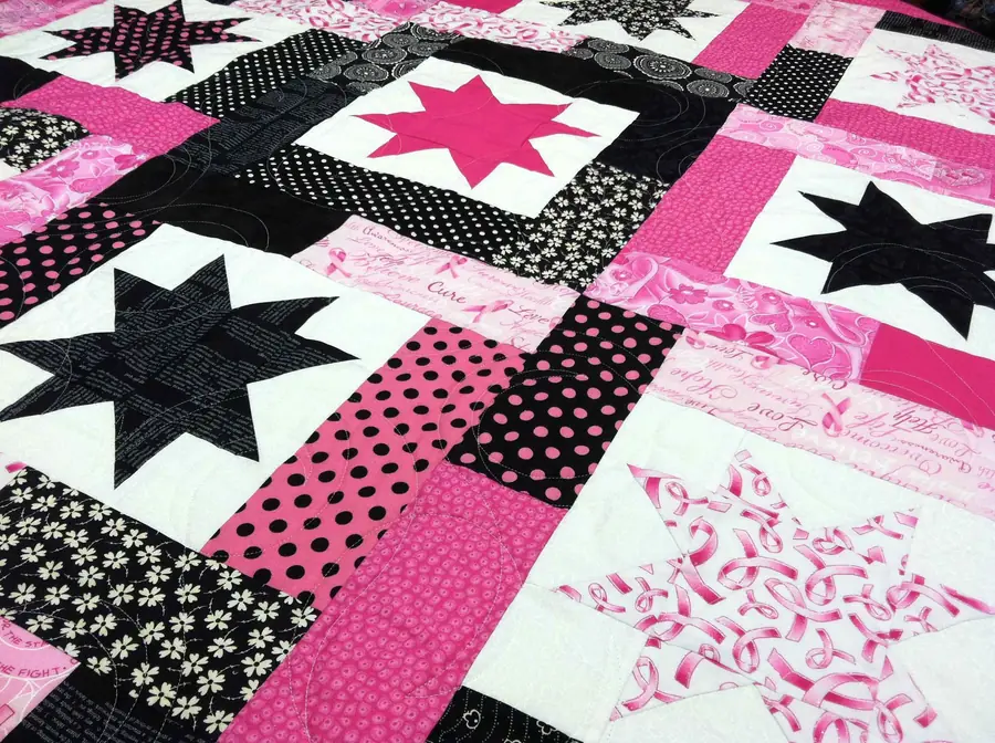 Pink and black star quilt