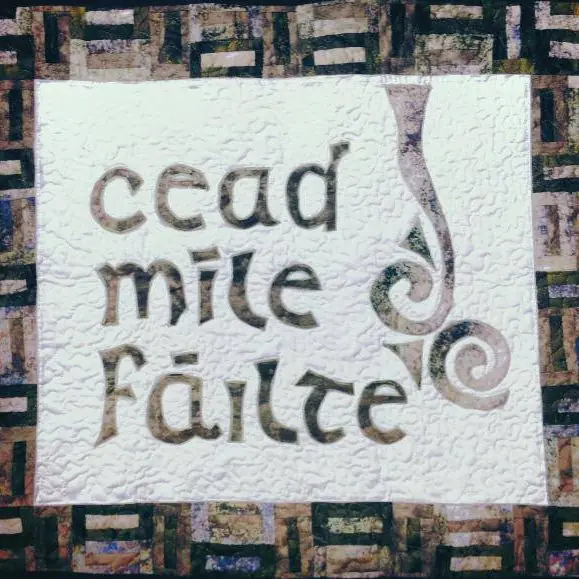 Quilted wall hanging that reads 'Céad míle fáilte' — a hundred thousand welcomes